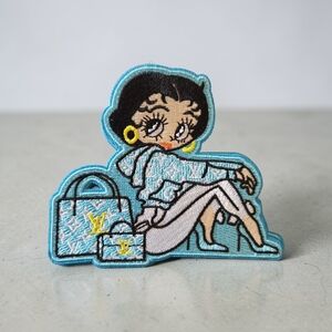 Blue Betty Embroidered Iron-On Patch with Handbag Motif